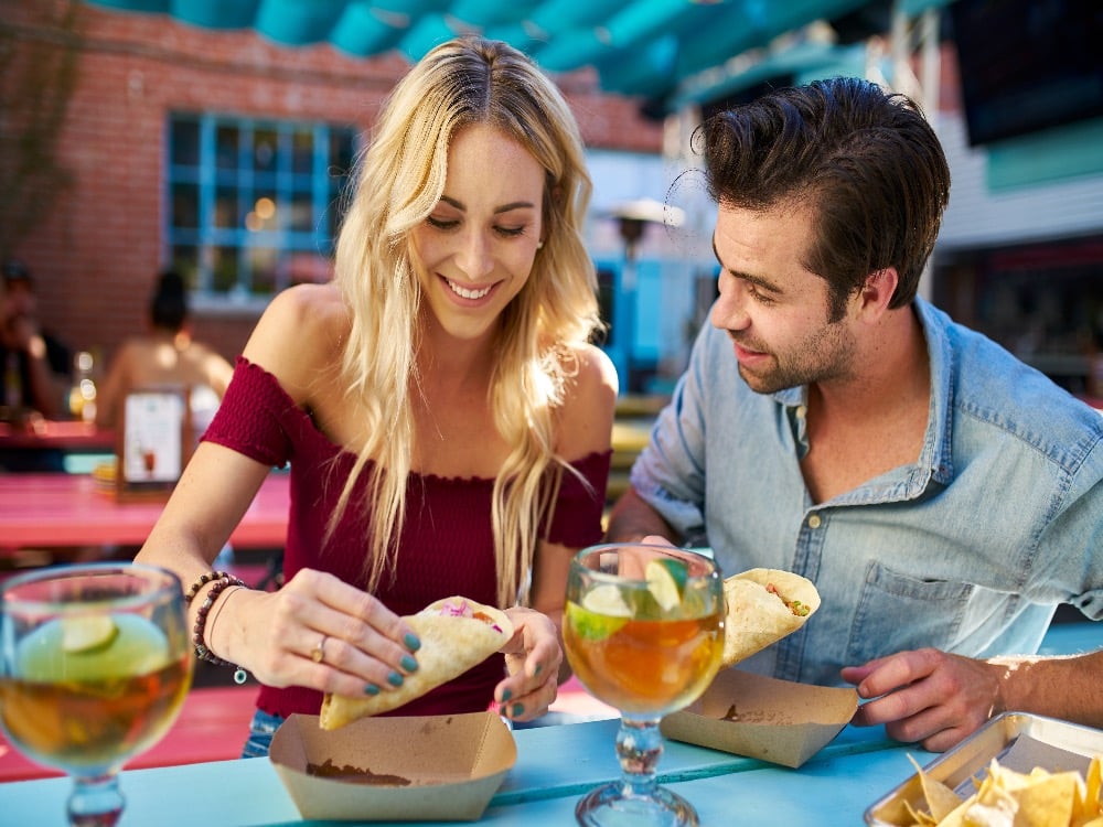 People eating Mexican food