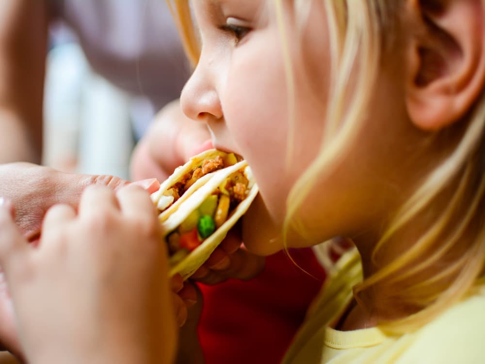 child eating mild Mexican food