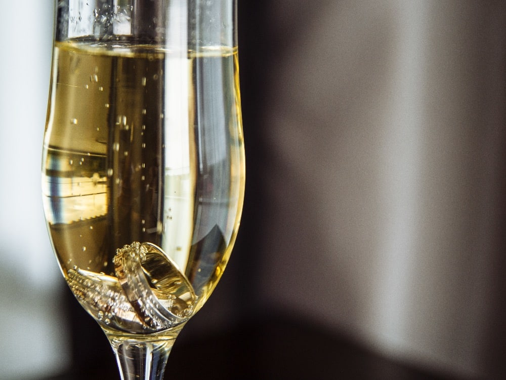 Champagne glass with a ring in it